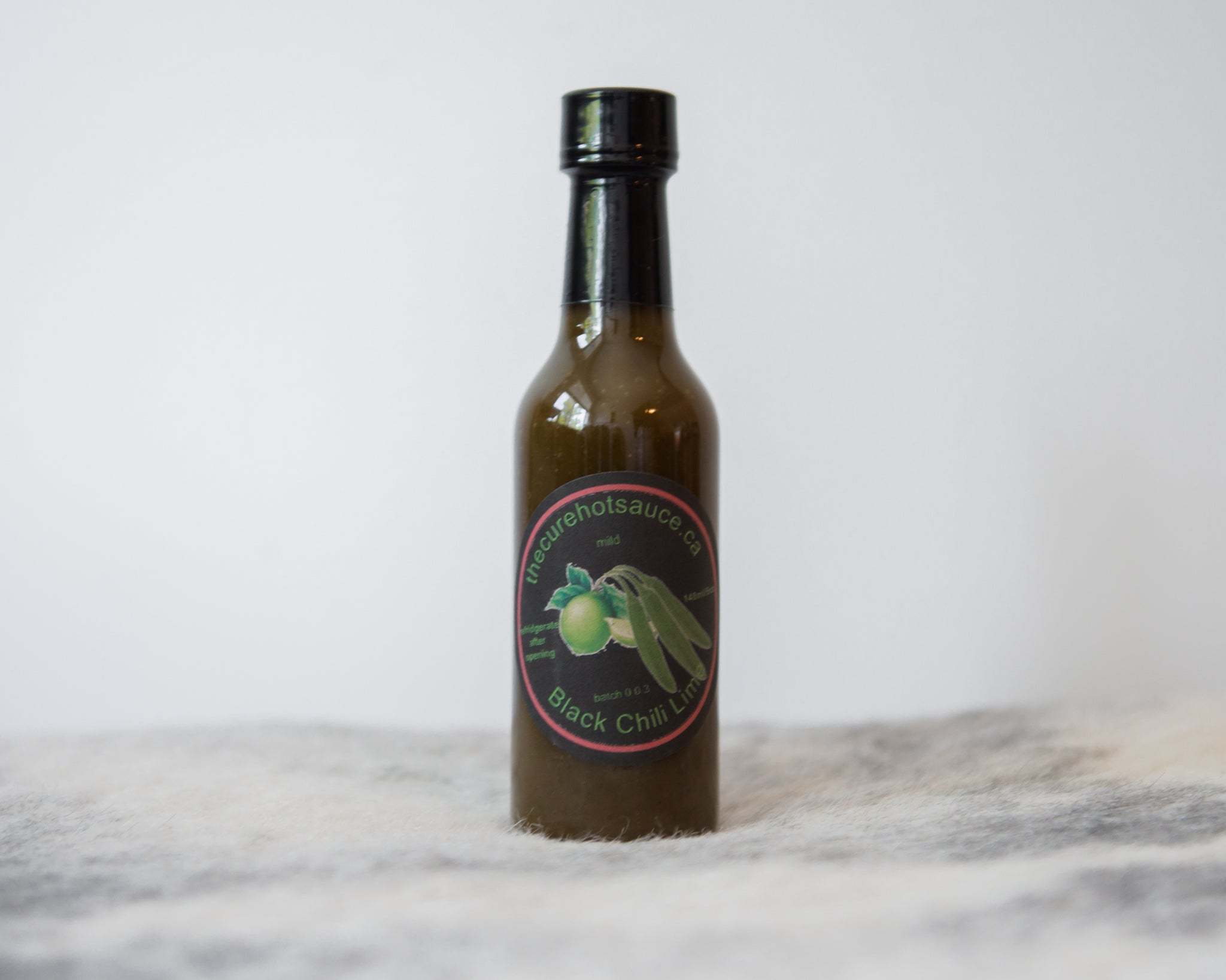 The Cure Hot Sauce | Black Chili Lime